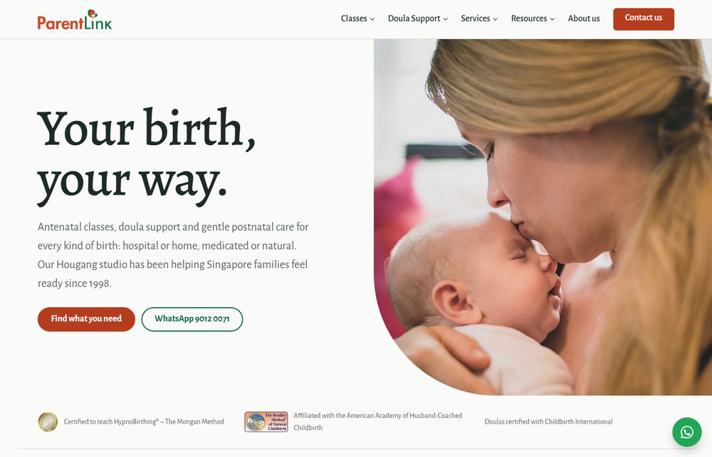 Option A homepage: a large serif headline beside a photo of a mother and newborn